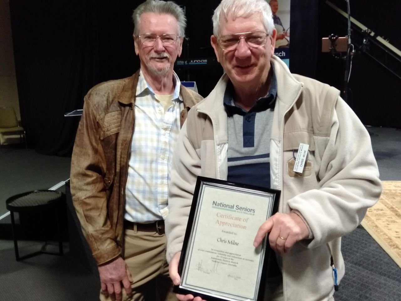 Chris Milne receiving a Certificate of Appreciation from the President Richard Arnold, for his 10 years as Branch Secretary