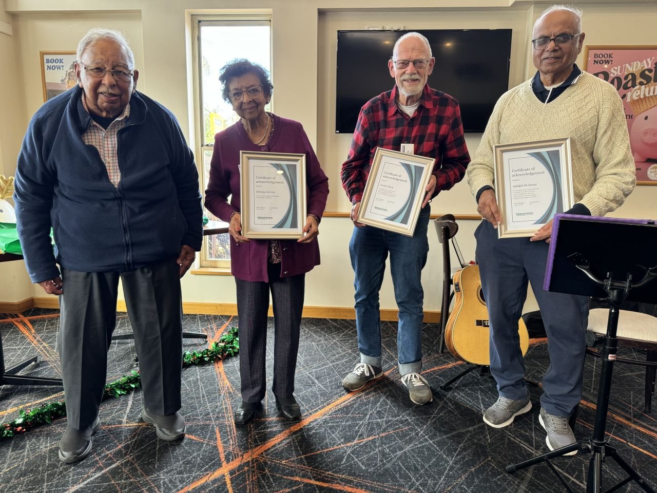 Chappie Lobo with recipients of Awards of recognitions Melody Correia, Curtis Clark and Adolph de Sousa