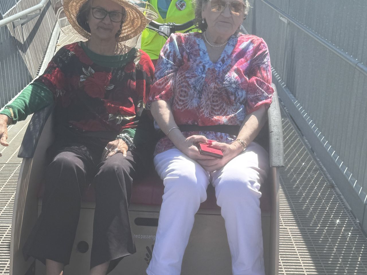 Melody Correia & Elizabeth Simionato on a trishaw in Cycling with wheels