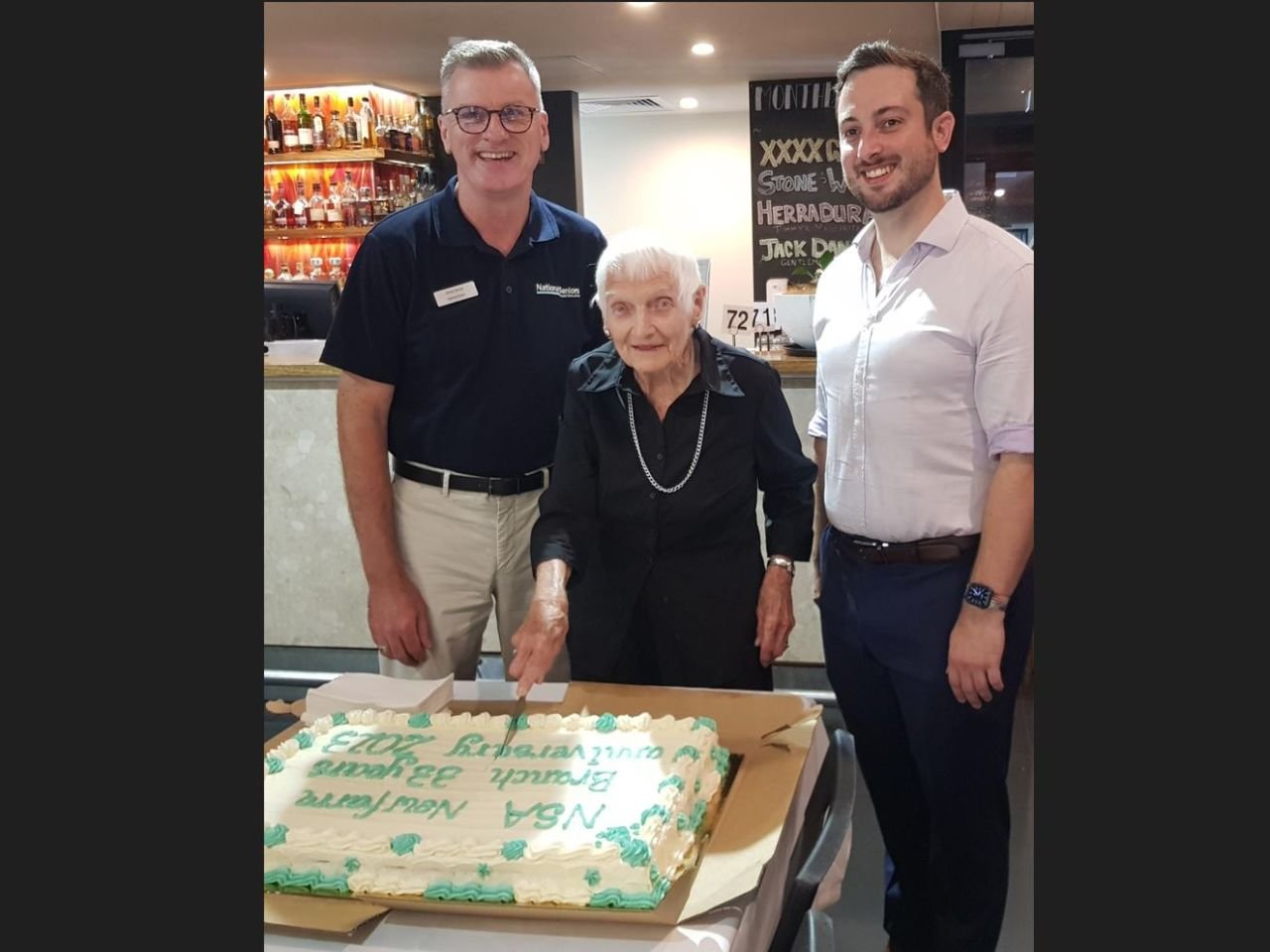 1st March 2023. The thirty-third  Anniversary Celebration of the New Farm Branch at the Brunswick Hotel.  Cutting the cake are Chris Grice NSA CEO, Mollie-Jean and Stephen Bates MP who kindly donated the cake.