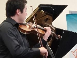 Shannon Rhodes playing the Violin.
Photo Courtesy Peter Macri